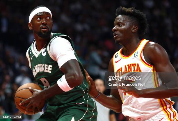 Bobby Portis Jr.#9 of Milwaukee Bucks is defended by Clint Capela#15 of Atlanta Hawks during the second preseason NBA game between Atlanta Hawks and...