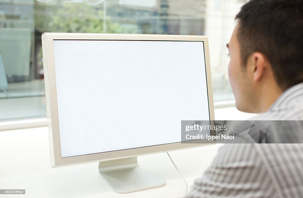 Man looking at computer screen