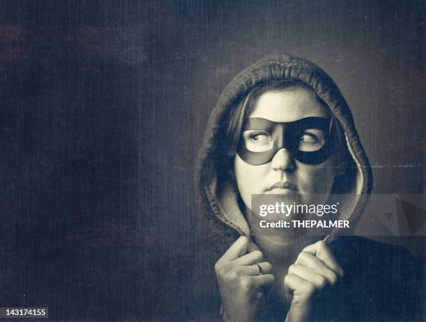 woman with a black mask - villain stock pictures, royalty-free photos & images