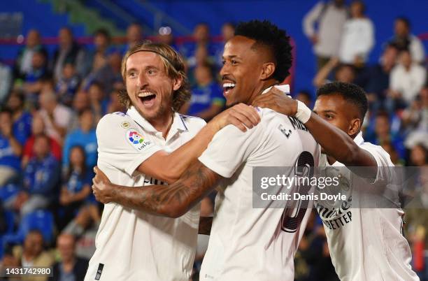 Eder Militao of Real Madrid celebrates with teammates Luka Modric and Rodrygo after scoring their team's first goal during the LaLiga Santander match...