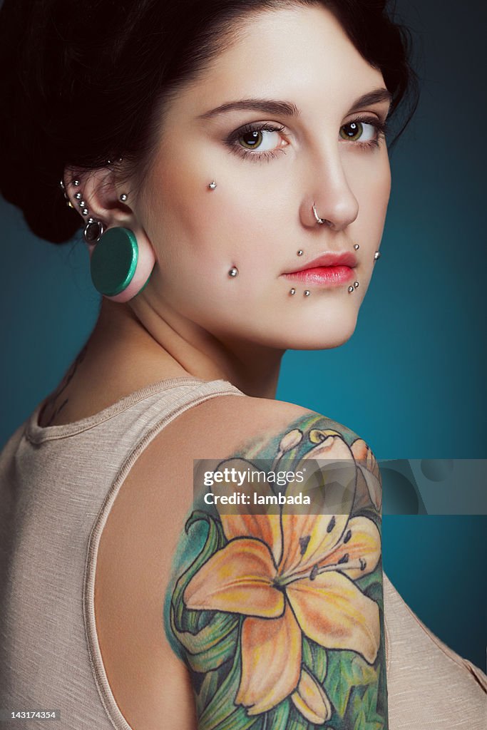 Beautiful Girl With Face Piercing And Tattoo High-Res Stock Photo - Getty  Images