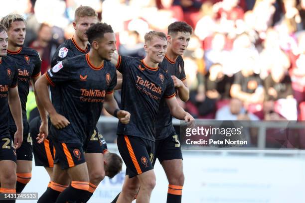 Ethan Galbraith of Salford City is congratulated by team mates after scoring his sides goal during the Sky Bet League Two between Northampton Town...