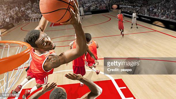 basketball hero does reverse slam dunk - slam dunk stock pictures, royalty-free photos & images