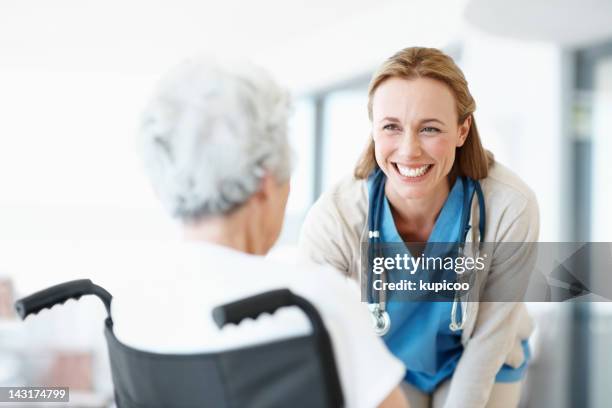 the patients i see are also my friends - nurse smiling stock pictures, royalty-free photos & images