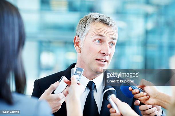 listening carefully to answer fairly - political press conference stock pictures, royalty-free photos & images