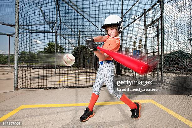 young baseball swing in batting cage - hitting children stock pictures, royalty-free photos & images