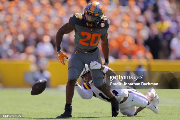 Sage Ryan of the LSU Tigers forces a fumble on Jaylen Wright of the Tennessee Volunteers during the second half a game at Tiger Stadium on October...