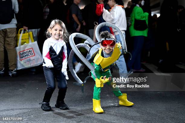Spider-Gwen and Dr. Octopus cosplayers pose during New York Comic Con 2022 on October 08, 2022 in New York City.