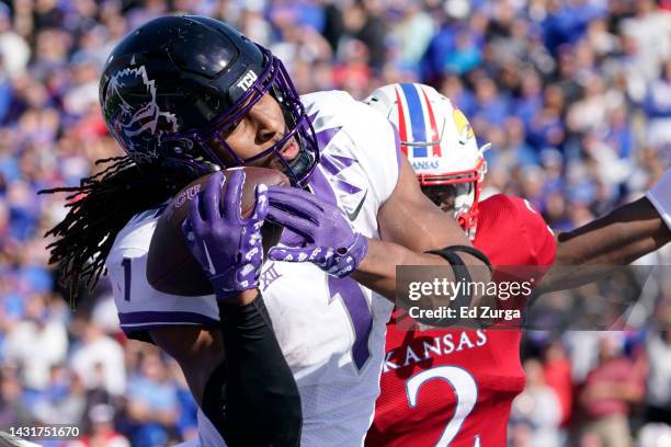 Wide receiver Quentin Johnston of the TCU Horned Frogs catches a touchdown pass against Cobee Bryant of the Kansas Jayhawks in the second half at...