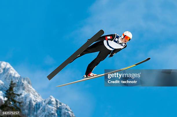ski jumper in mid-air - backhoppning bildbanksfoton och bilder