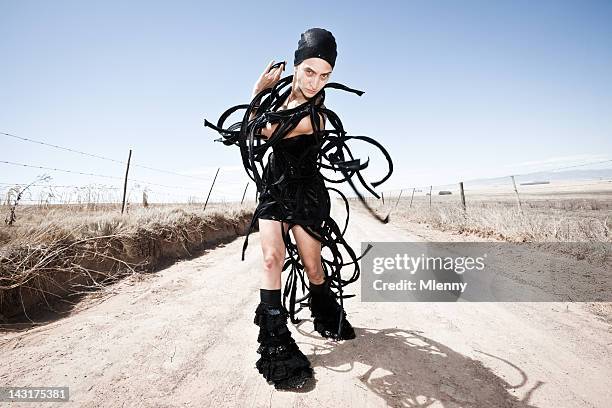 alien fashion surreal south african gravel road portrait - shaved head stock pictures, royalty-free photos & images