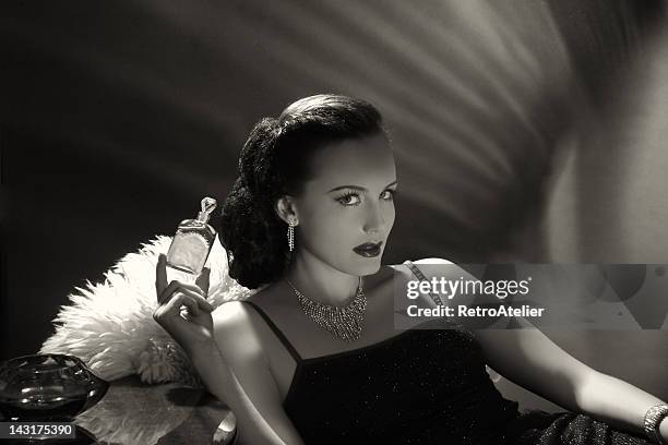 noir style.new fragrance - hollywood actress stock pictures, royalty-free photos & images