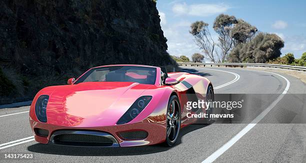 sports car on coastal road. - luxury cars stock pictures, royalty-free photos & images
