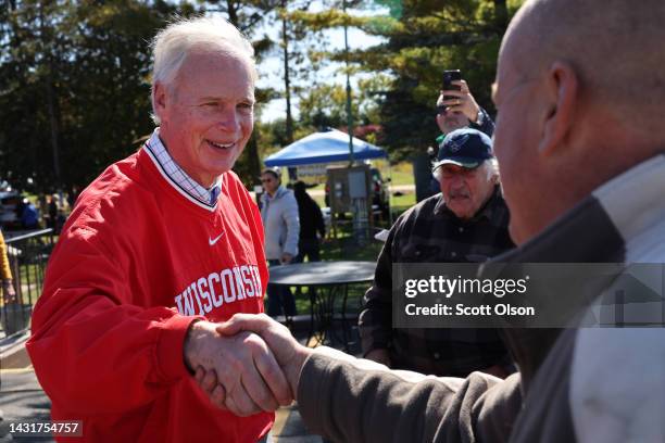 Sen. Ron Johnson greets people during a campaign stop at the Moose Lodge Octoberfest celebration on October 08, 2022 in Muskego, Wisconsin. Johnson...