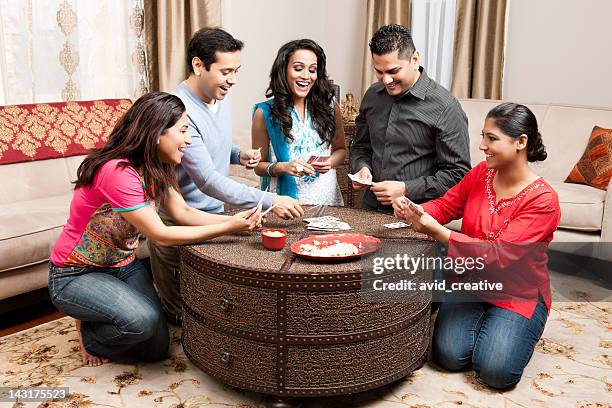 indian friends playing cards at home - arab men playing cards stockfoto's en -beelden