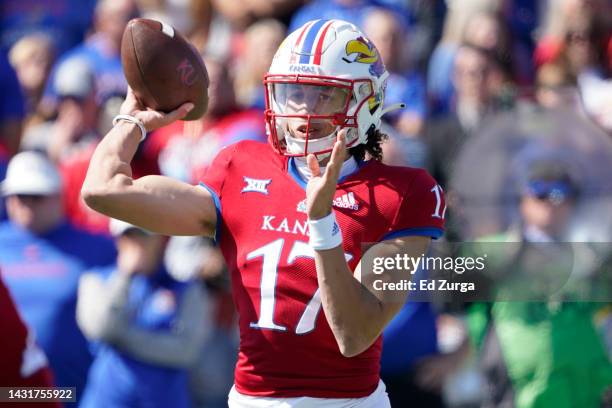 Quarterback Jason Bean of the Kansas Jayhawks passes against the TCU Horned Frogs in the second half at David Booth Kansas Memorial Stadium on...