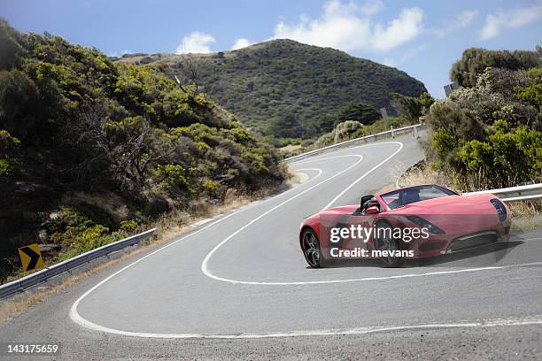 sports car on a coastal road - red porsche stock pictures, royalty-free photos & images