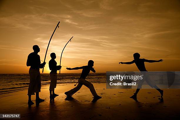 capoeira and berimbau player - jericoacoara beach stock pictures, royalty-free photos & images