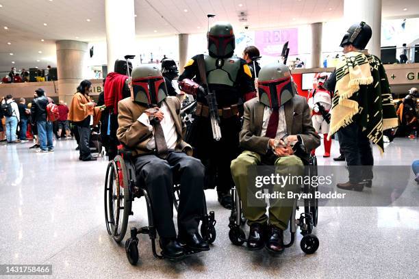 Mandolorian cosplayers pose during New York Comic Con 2022 on October 08, 2022 in New York City.