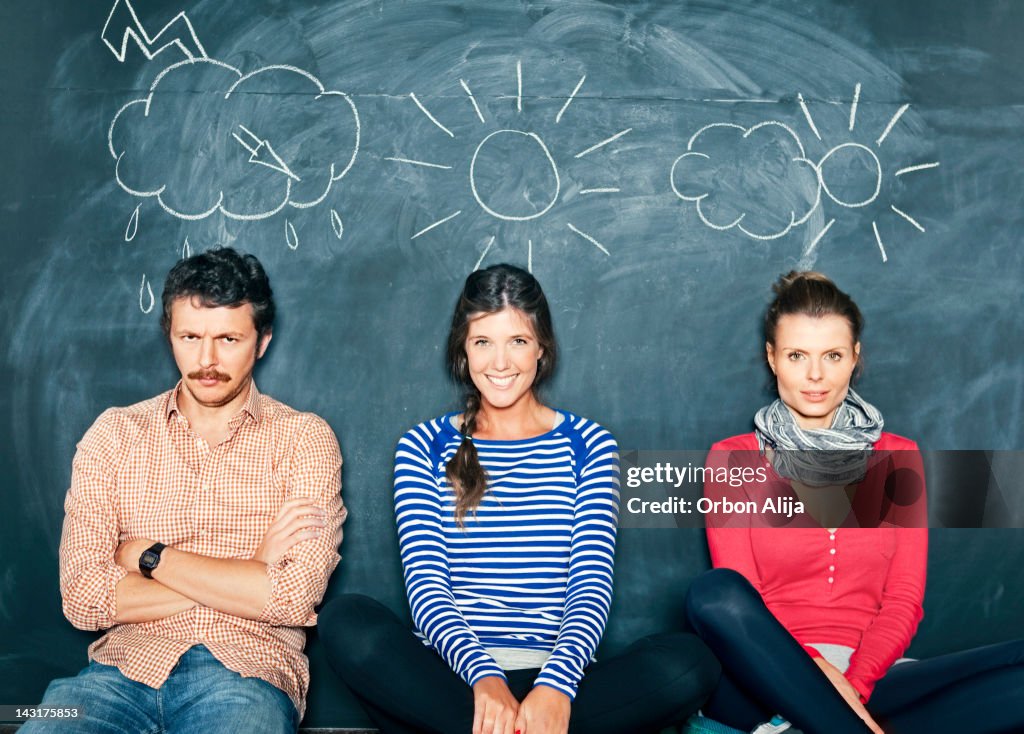 Designers in front of a blackboard
