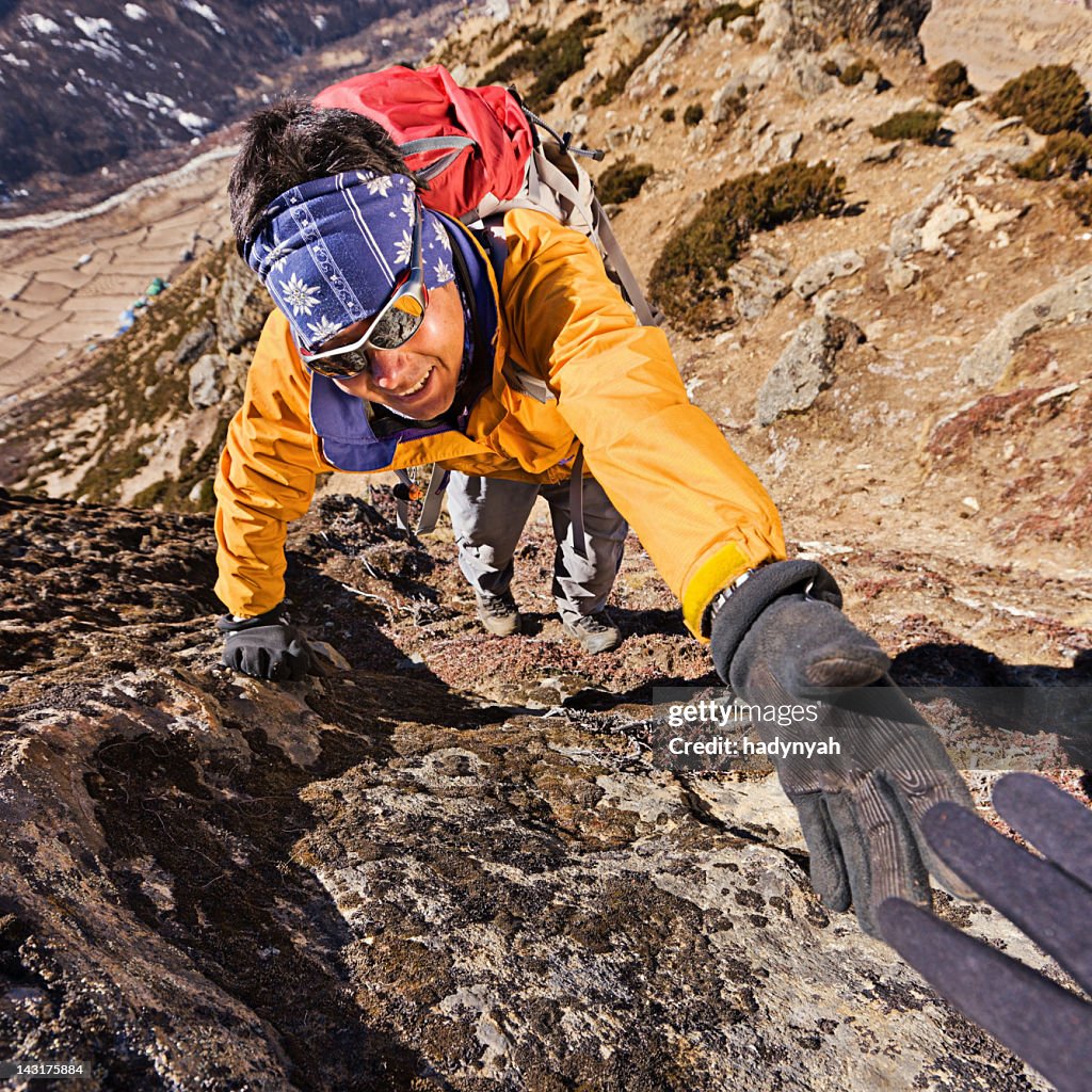 Nepali sherpa climbing in Himalayas