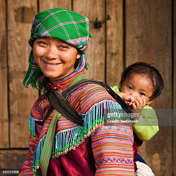vietnamese mother from flower hmong tribe with her baby - hmong village stock pictures, royalty-free photos & images