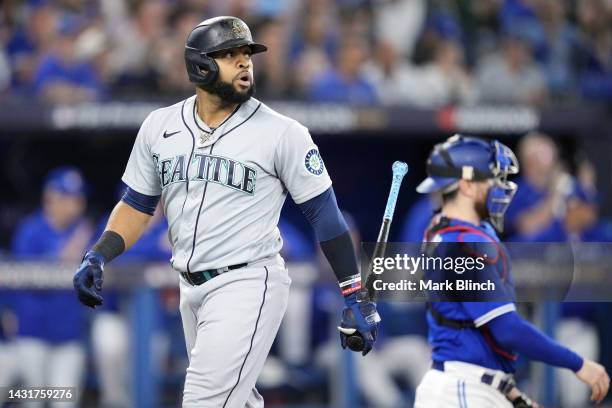 Carlos Santana of the Seattle Mariners reacts after striking out against Kevin Gausman of the Toronto Blue Jays during the second inning in game two...