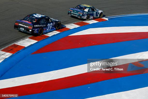 Ryan Sieg, driver of the CMRoofing.com/A-Game Ford, and Daniel Hemric, driver of the AG1 - Athletic Greens Chevrolet, race during the NASCAR Xfinity...