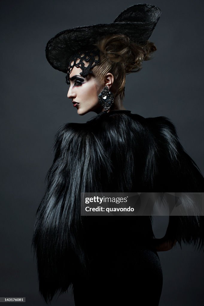 Avant Garde Fashion Model in Fur Coat and Hat, Updo