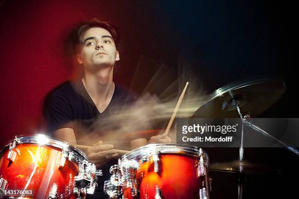 drummer in motion playing drums - hitting drum stock pictures, royalty-free photos & images