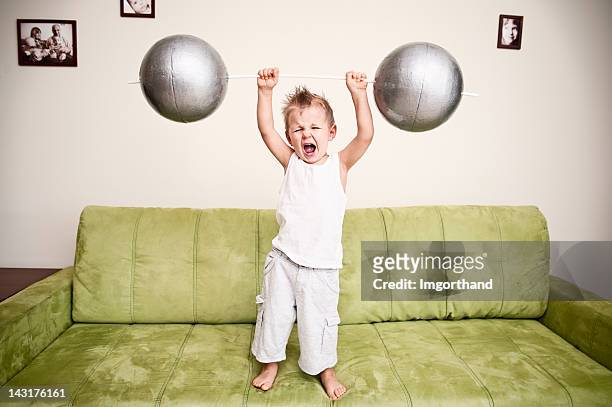 strong boy - strongman stock pictures, royalty-free photos & images