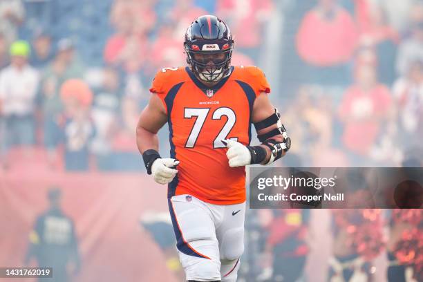 Garett Bolles of the Denver Broncos runs out during introductions against the Indianapolis Colts at Empower Field at Mile High on October 6, 2022 in...