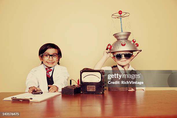 adventures in mind reading - young inventor stock pictures, royalty-free photos & images