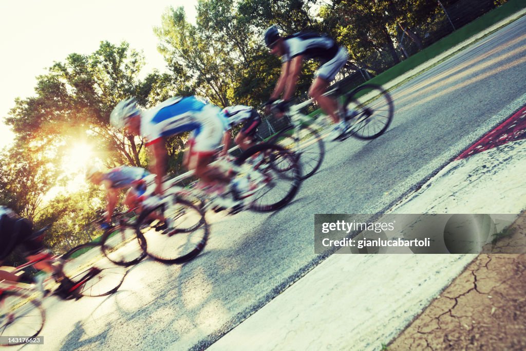 Group of cyclists rushing by camera