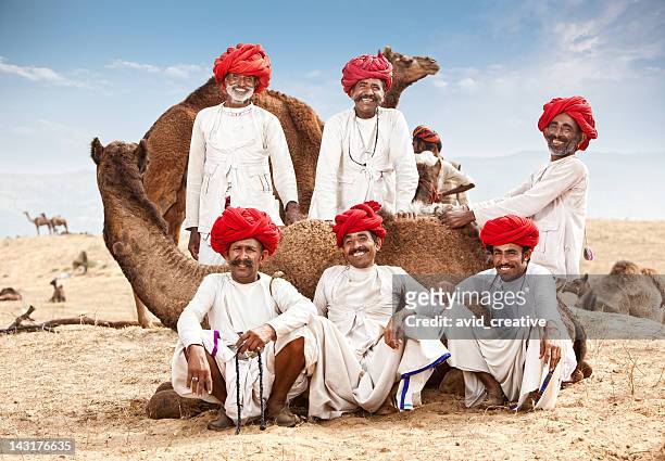 happy group of camel drivers - ethnicity stock pictures, royalty-free photos & images