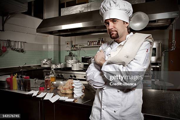 young chef in his restaurant kitchen - goatee stockfoto's en -beelden