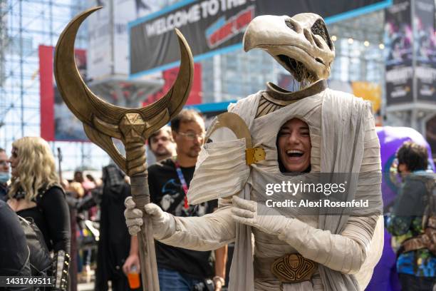 Jennifer Barlow , 28 years-old from New Jersey dressed as Khonshu from "Moon Knight" laughs after removing a piece covering her face at New York...