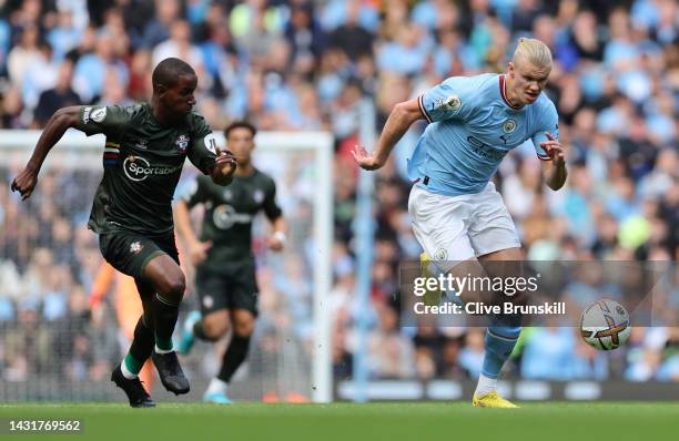 Erling Haaland of Manchester City runs for the ball under pressure during the Premier League match between Manchester City and Southampton FC at...