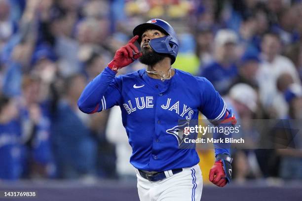 Teoscar Hernandez of the Toronto Blue Jays celebrates after hitting a home run to center field against Robbie Ray of the Seattle Mariners during the...