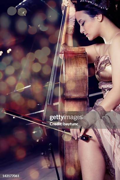 cello playing cellist musician - soloist stock pictures, royalty-free photos & images