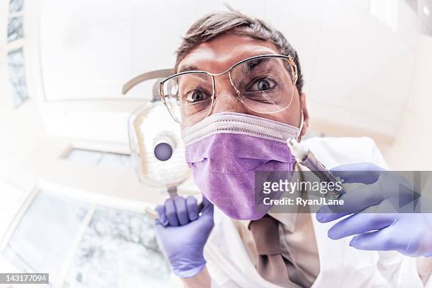 crazy dentista con jeringa - dental fear fotografías e imágenes de stock