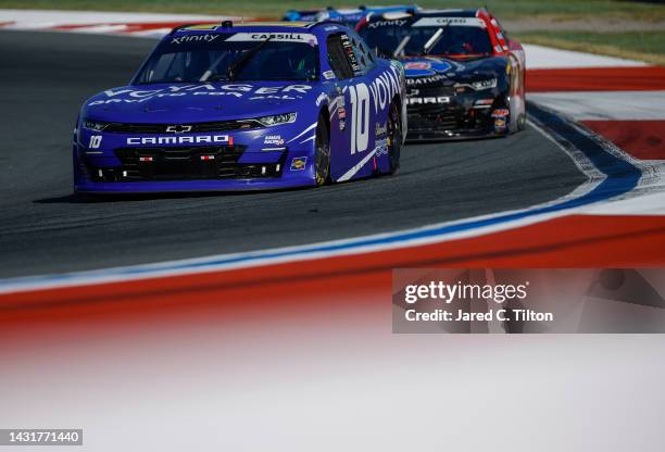 Landon Cassill, driver of the Voyager: Crypto for All Chevrolet, drives during the NASCAR Xfinity Series Drive for the Cure 250 presented by...