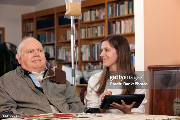 home healthcare nurse and patient exchange smiles - nasogastrisk sond bildbanksfoton och bilder