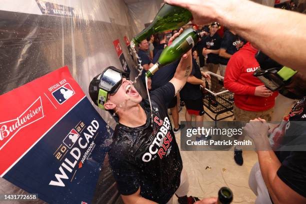 Members of the Cleveland Guardians celebrate in the clubhouse following their victory against the Tampa Bay Rays in game two of the Wild Card Series...