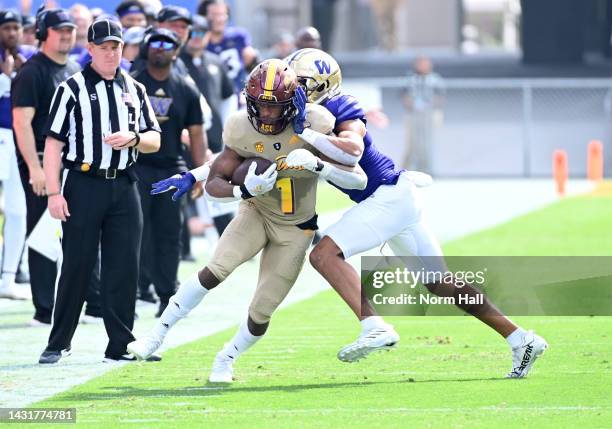 Valladay of the Arizona State University Sun Devils is tackled by Alex Cook of the University of Washington Huskies during the second quarter at Sun...