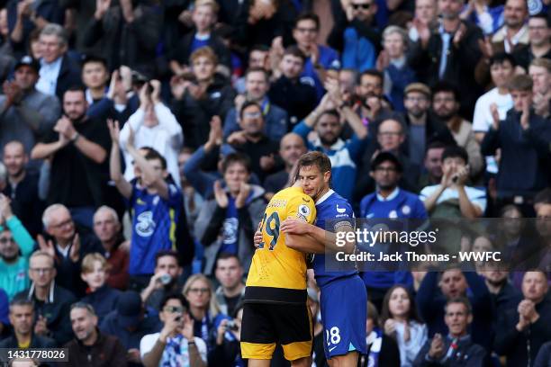 Diego Costa of Wolverhampton Wanderers embraces Cesar Azpilicueta of Chelsea after being substituted off during the Premier League match between...