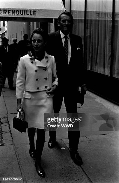 Actor Gregory Peck and Veronique Peck leave La Grenouille restaurant after a meal on October 27, 1967 in New York City.