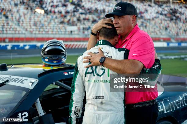 Daniel Hemric, driver of the AG1 - Athletic Greens Chevrolet, is embraced by Chris Rice, President of Kaulig Racing after the NASCAR Xfinity Series...