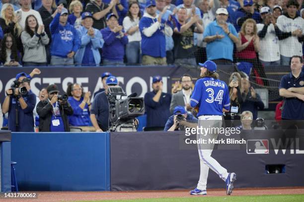 Kevin Gausman of the Toronto Blue Jays walks back to the dugout after being relieved against the Seattle Mariners during the sixth inning in game two...