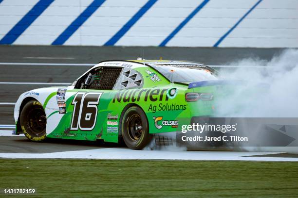 Allmendinger, driver of the Nutrien Ag Solutions Chevrolet, celebrates with a burnout after winning the NASCAR Xfinity Series Drive for the Cure 250...